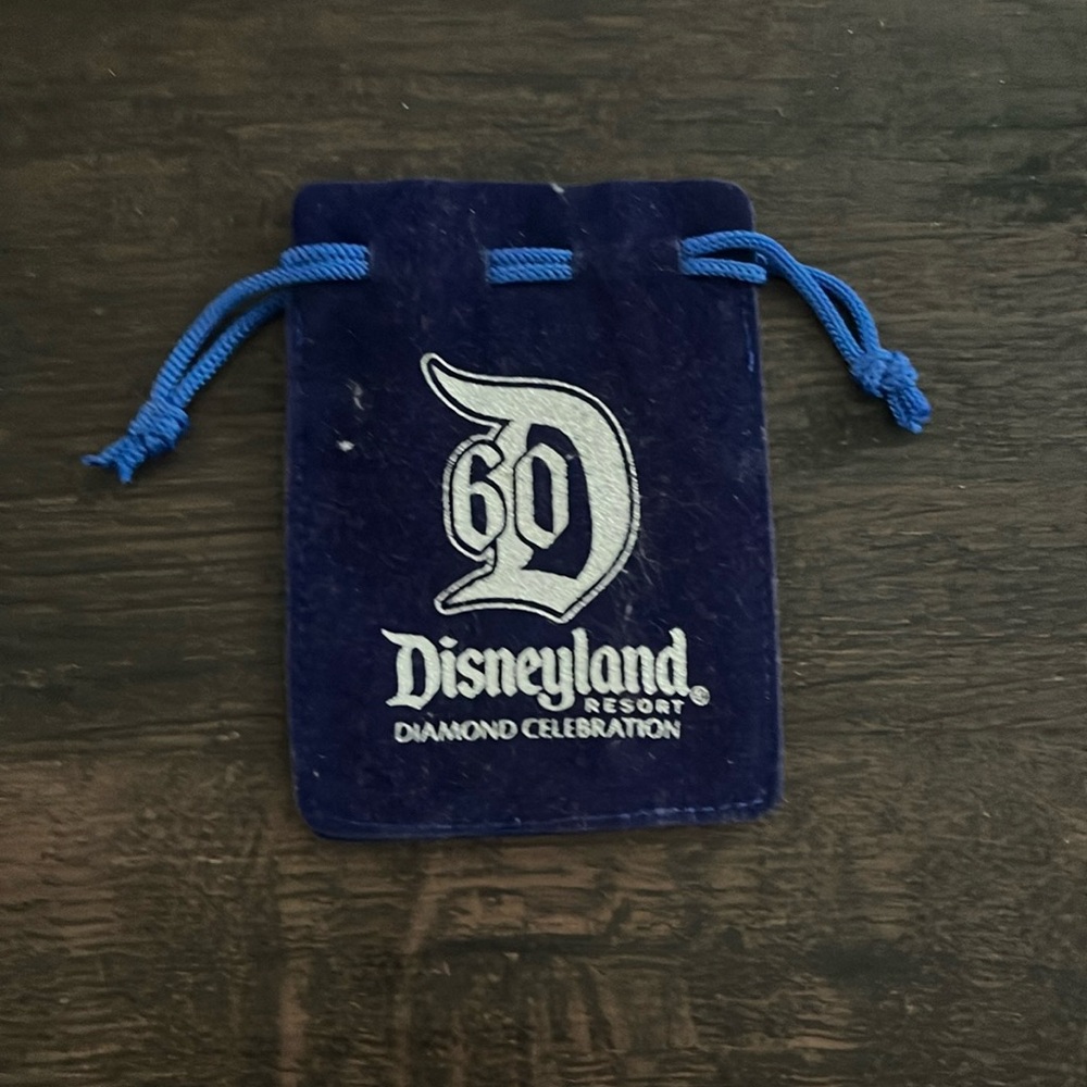 Disneyland drawstring pouch (Pokémon card for reference, not included in sale)
